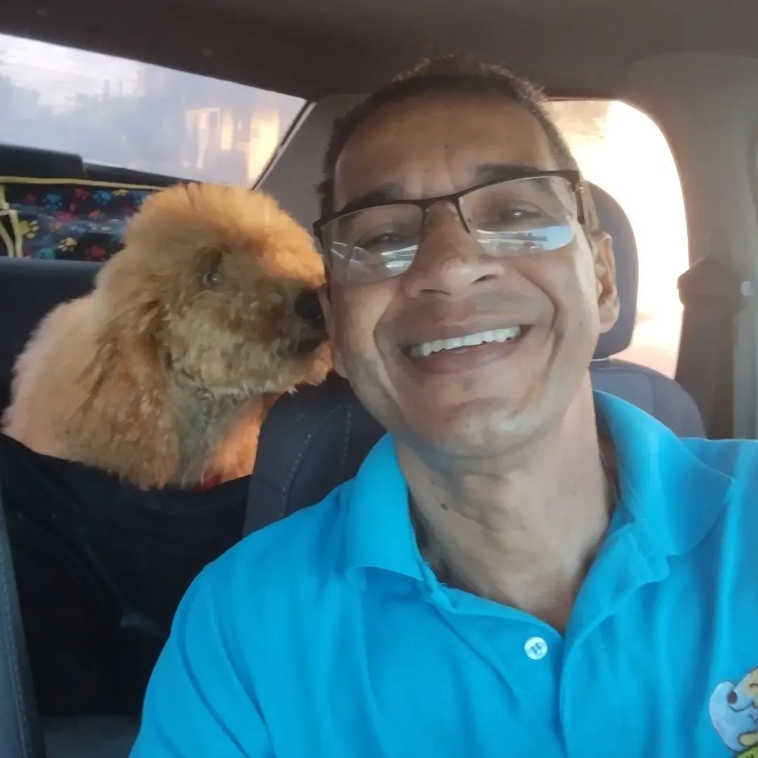 Hamilton Taurino gets kisses from fluffy golden doodle