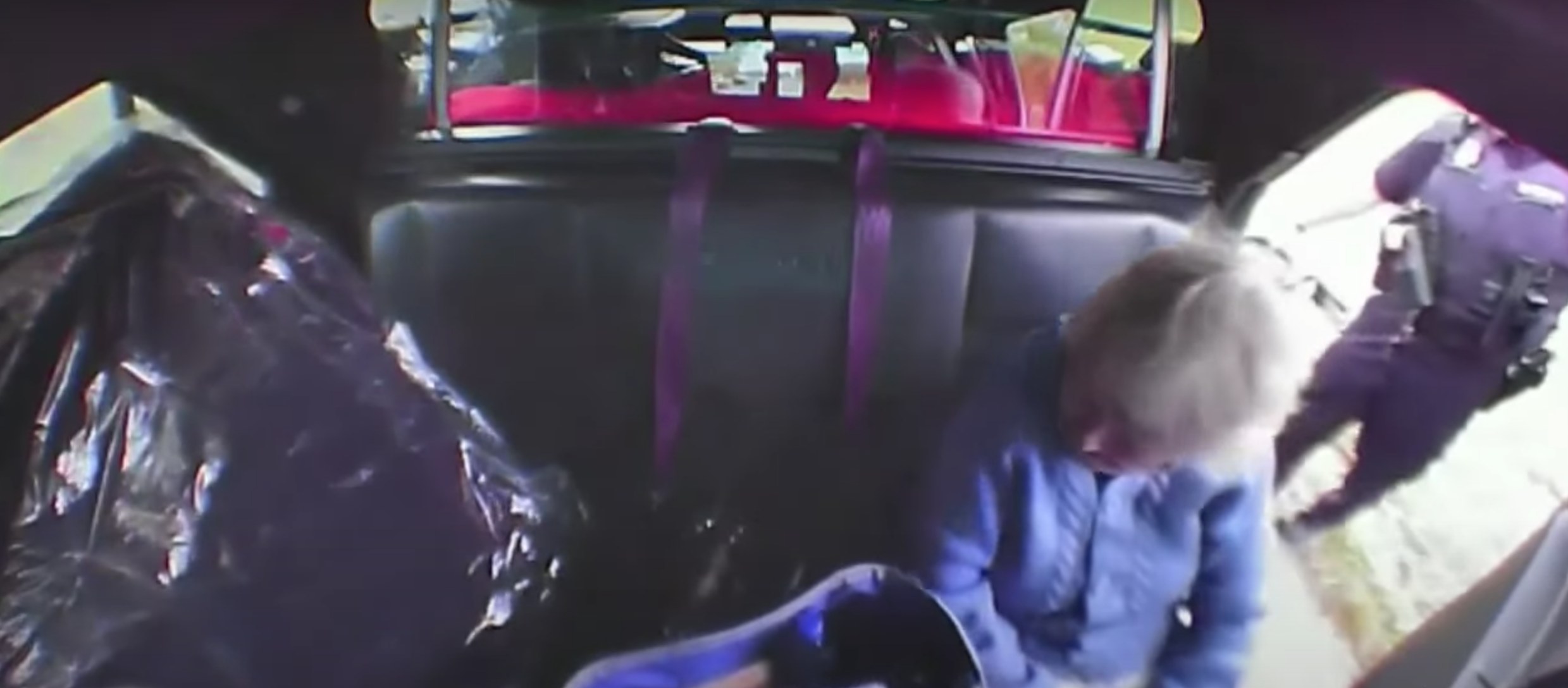 elizabeth good on the backseat of officer hofmeister's patrol car.