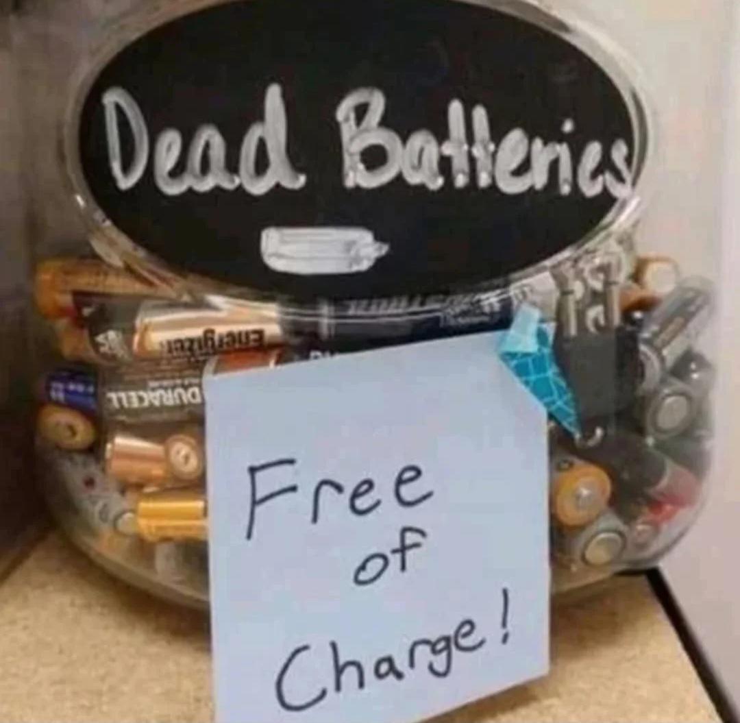 a bowl that has many batteries in it and text that says "dead batteries" and a post-it that says "free of charge."