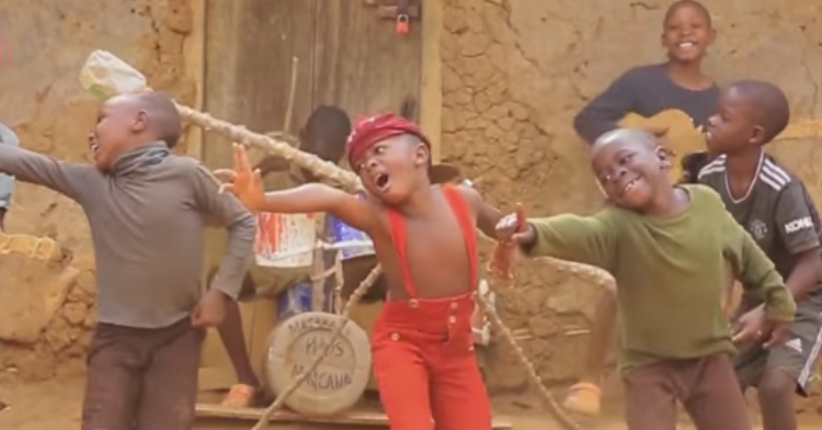 kids from the group masaka kids africana dancing and playing instruments to the song as it was by harry styles