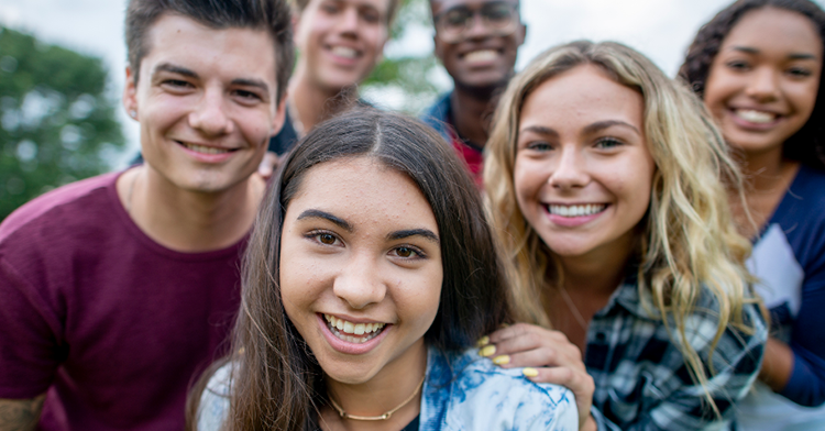 teenagers posing together for photo