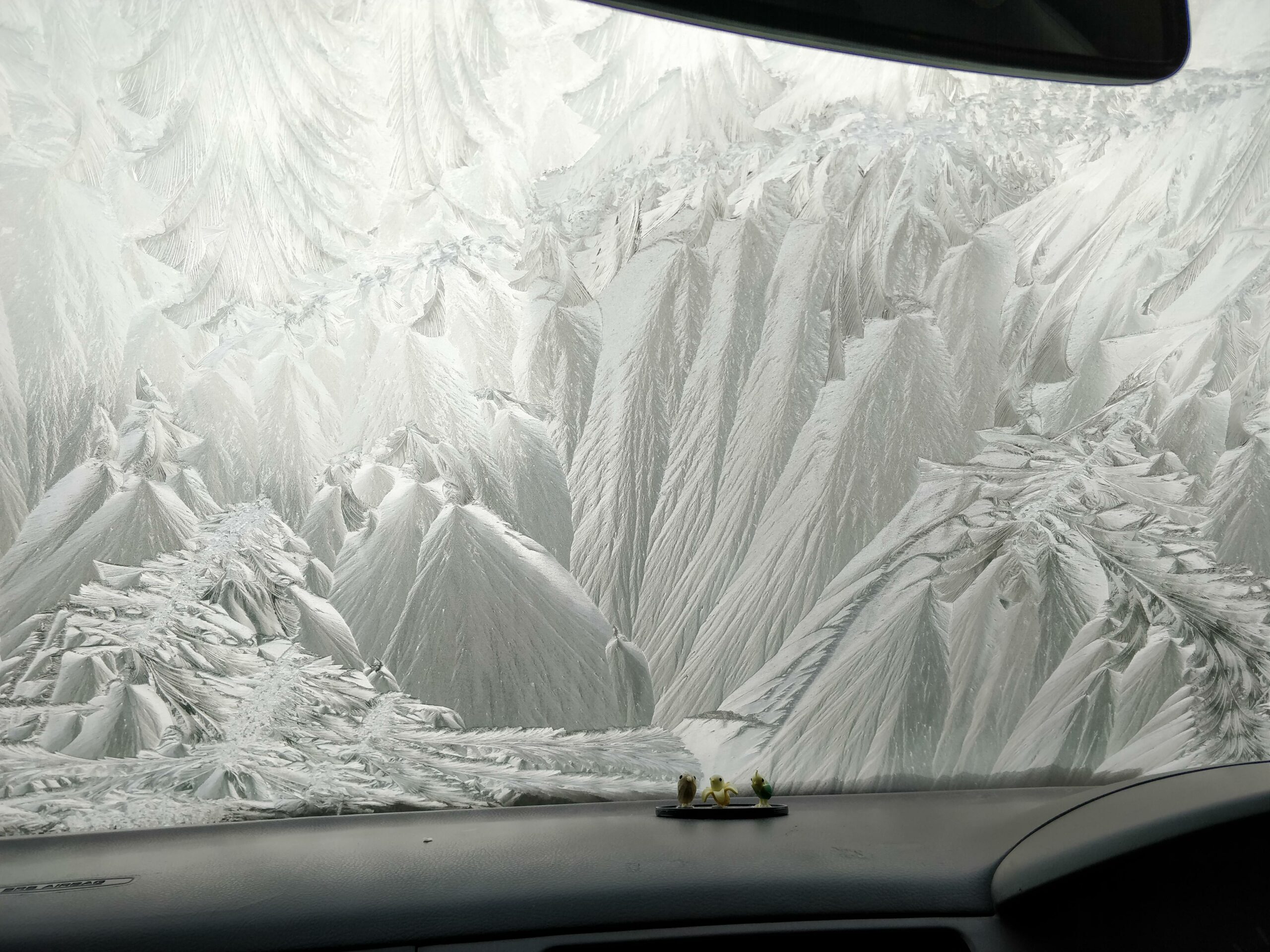 ice on a frozen windshield that looks like an icy mountain landscape