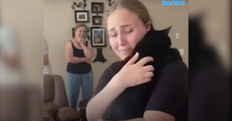 Sasha Khvorostiana hugging her cat Bony after being finally reunited