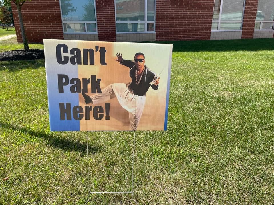 funny PTA sign featuring MC Hammer and words "Can't Park Here."