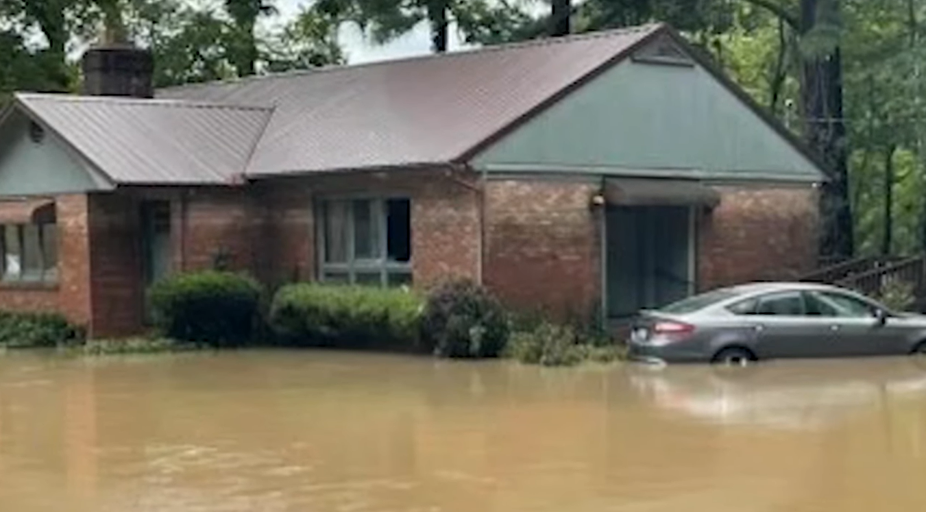 Amburgey home in Kentucky surrounded on all sides by flood waters.