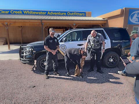 Fremont County Sheriff's Office smiles with Taylor Salazar and her newly-found dog, Farah.