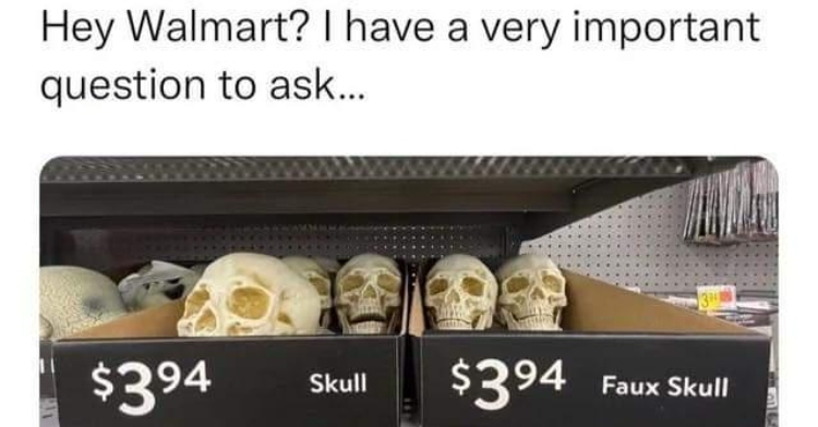 Walmart shelf with two boxes of fake skulls, but only one says "fake skulls" and the other just says "skulls"