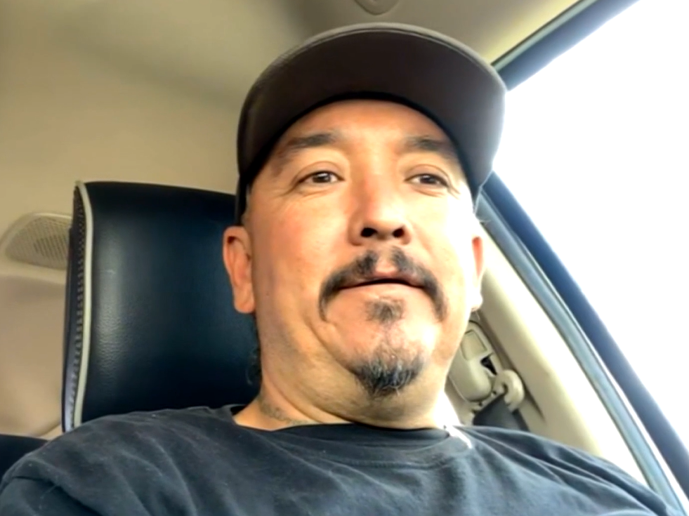 Frank Martinez taking a selfie while sitting in a car.