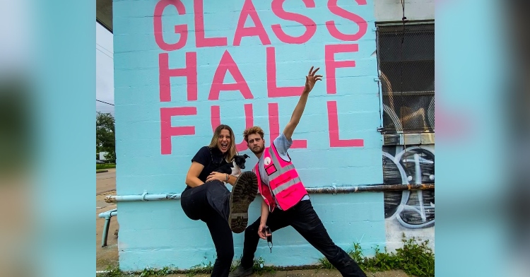 Franziska Trautmann and Max Steitz strike a pose outside of Glass Half Full recycling center