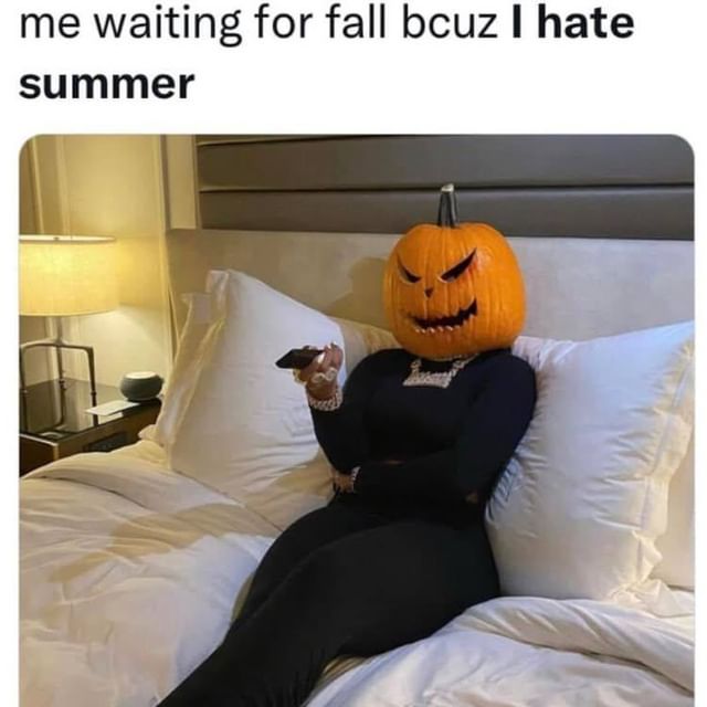 person wearing jack o'lantern head while flipping channels on the couch. Caption says: "me waiting for fall bcuz I hate summer"