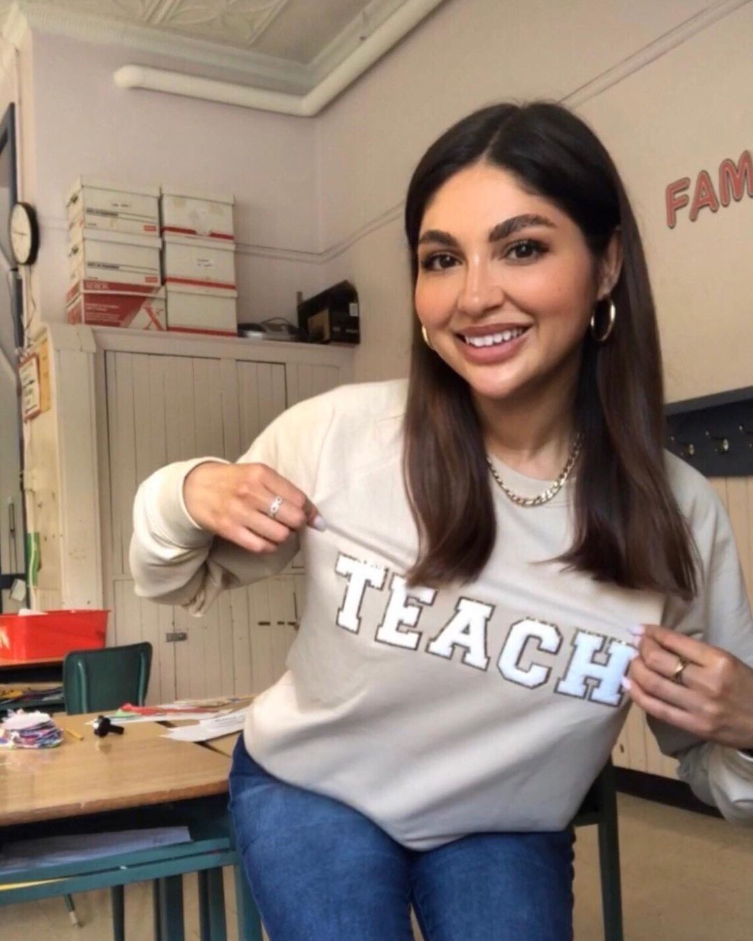 teacher Stephanie wearing an "I teach" shirt.