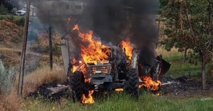 Logan Shneider's tractor on fire after being hit by helicopter