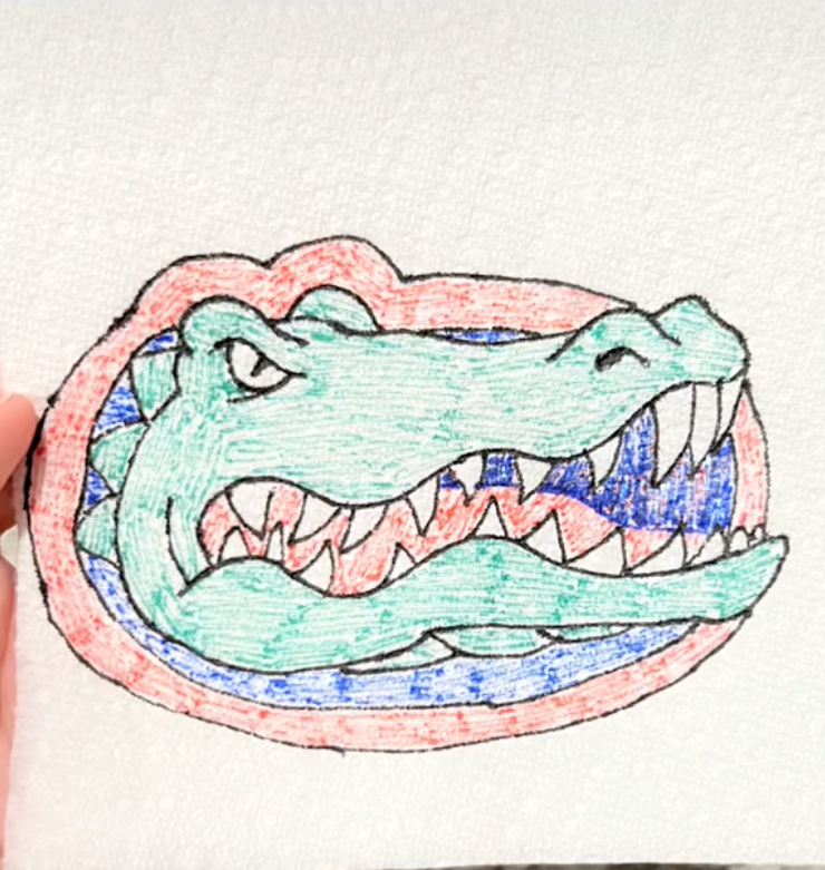 drawing of a crocodile on a napkin.