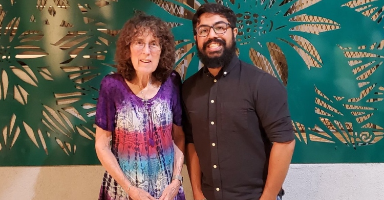 susannah lung and jamil jan kochai smiling as they pose next to each other for a photo.