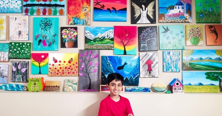 Arsh Pal poses with some of his artwork