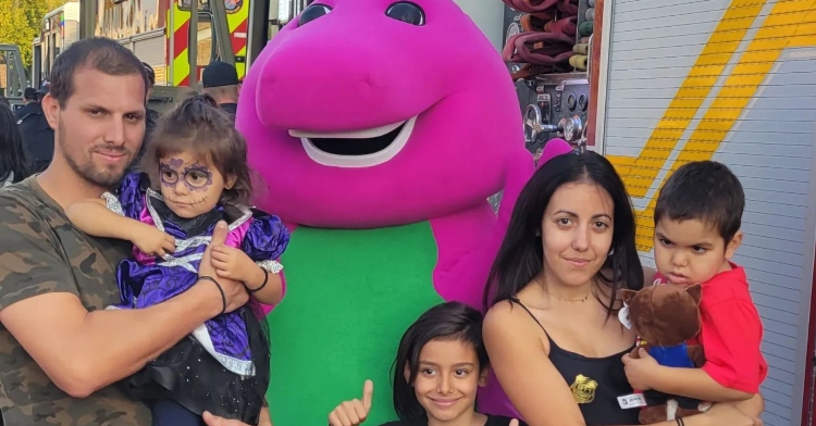 Hurdakis family pose with Barney at Halloween event organized by community for terminal son.