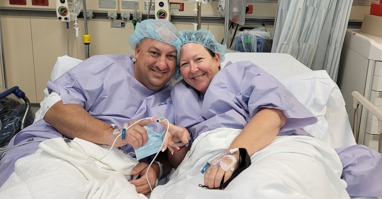 Jeff Hackman and sister Dawn Martin smiling in hospital beds after kidney transplant surgery.
