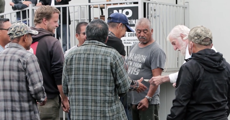 Dick Van Dyke hands out cash on the street