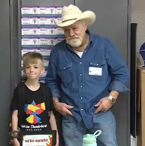 Garrett Brown and his father at assembly at Lakeview Elementary School in Norman, OK