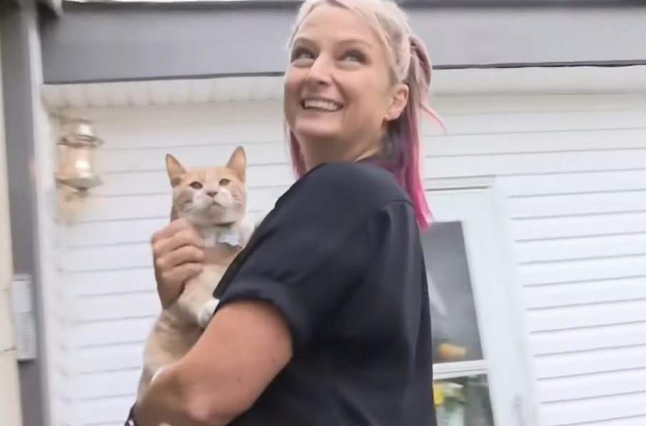 Heidi Stamper holding Thor outside her home in Michigan.
