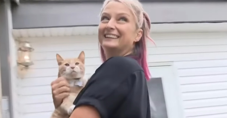 Heidi Stamper holds Thor the kitten outside their Michigan home.