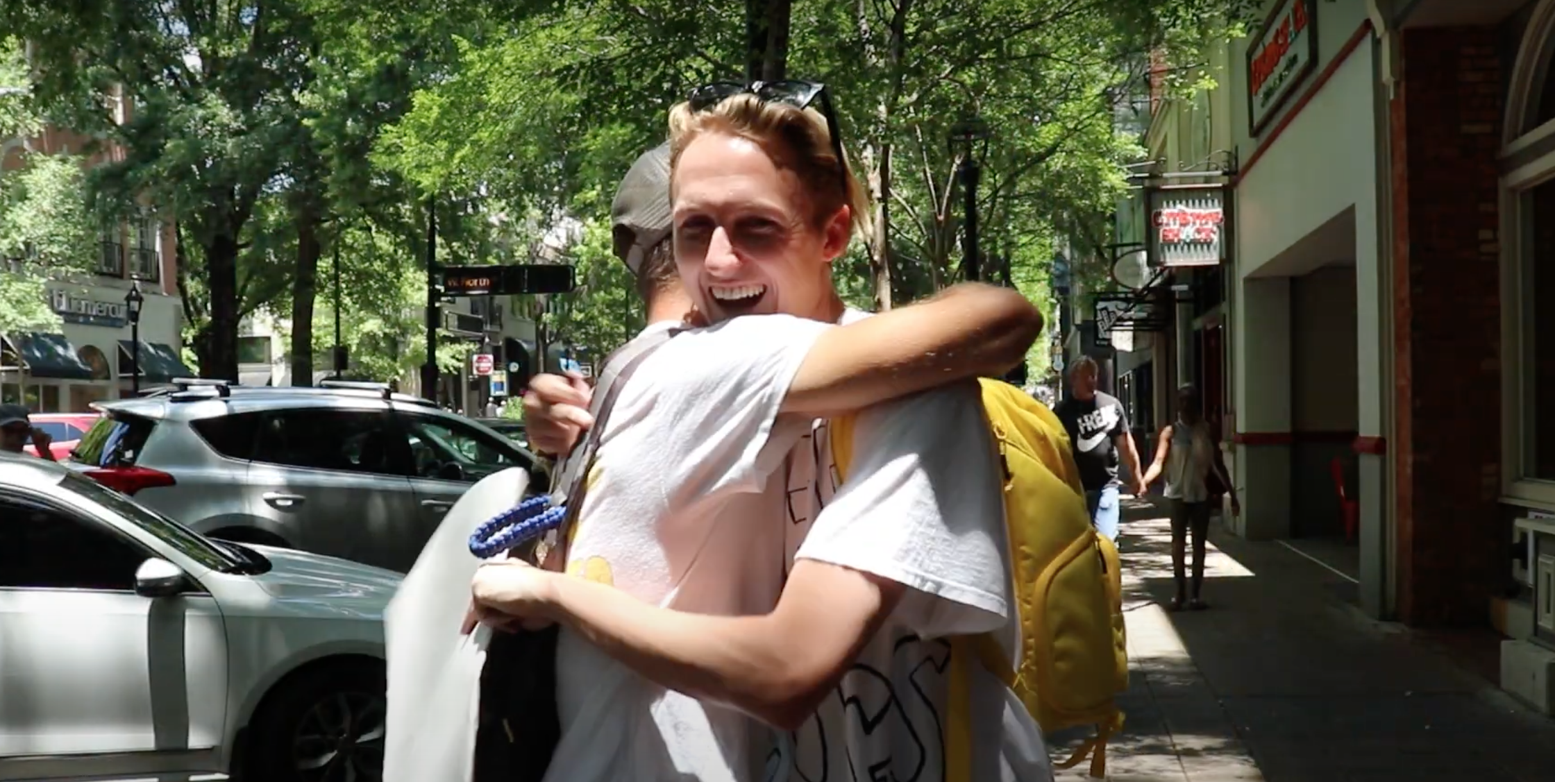 zach mcintyre hugging a stranger in downtown greenville