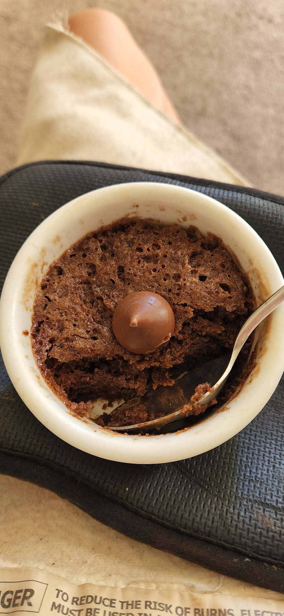 brownie in a bowl with a kisses chocolate on top.