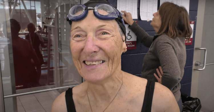 charlotte sandal wearing her bathing suit and smiling to the camera.