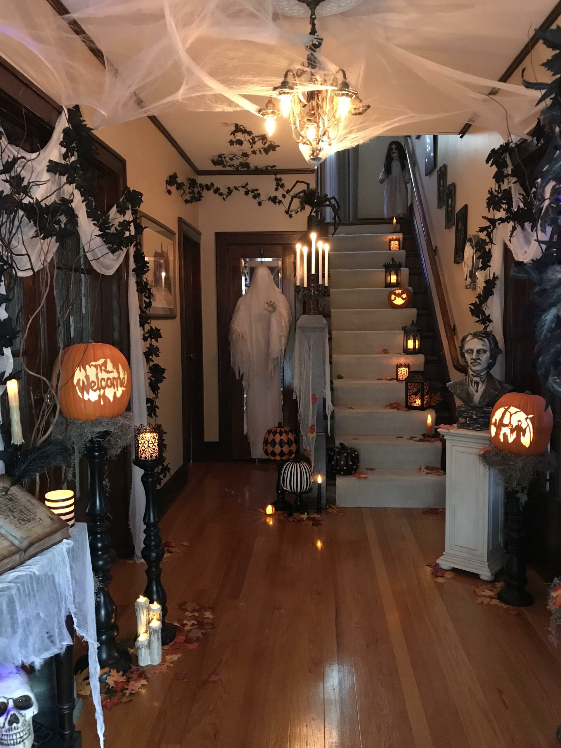front hallway that has been decorated with Halloween decorations.