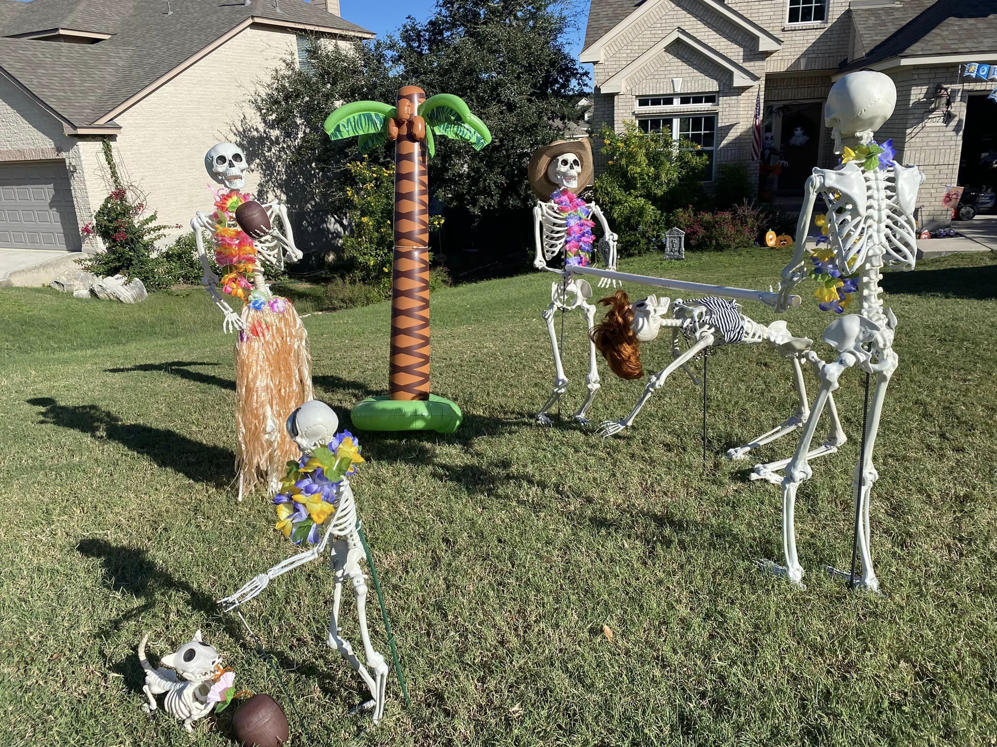 Skeleton House of San Antonio display of skeletons holding a luau