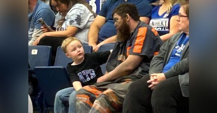 coal miner Michael McGuire with son at basketball game