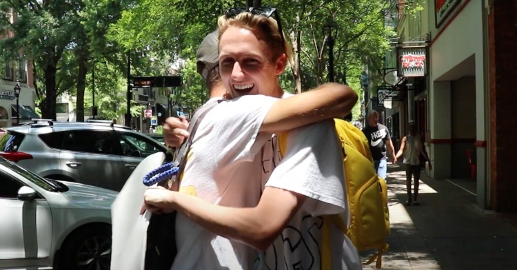 zach mcintyre hugging a stranger in downtown greenville