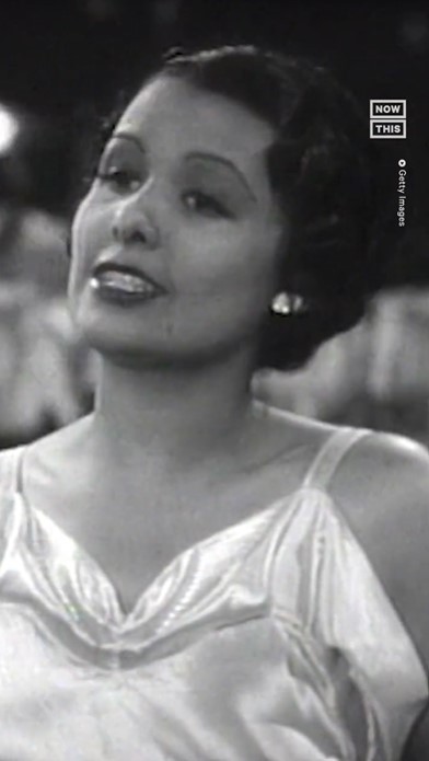 Black and white photo of Lena Horne singing when she was young.