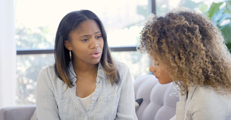 two women speaking