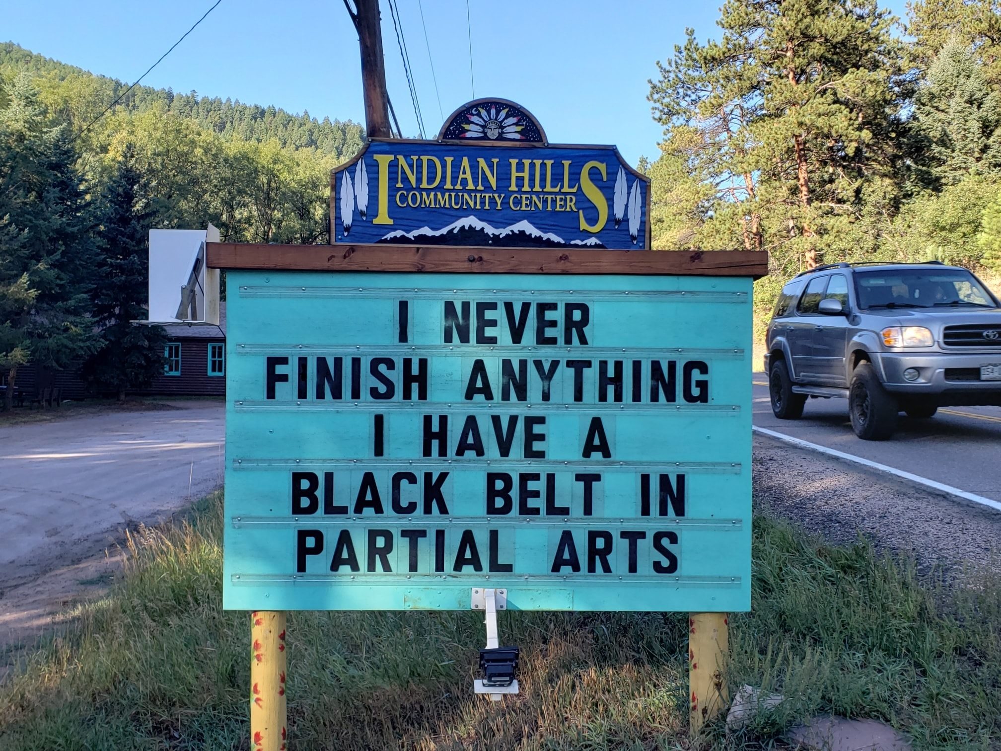 community sign that says: "I never finish anything I have a black belt in partial arts."