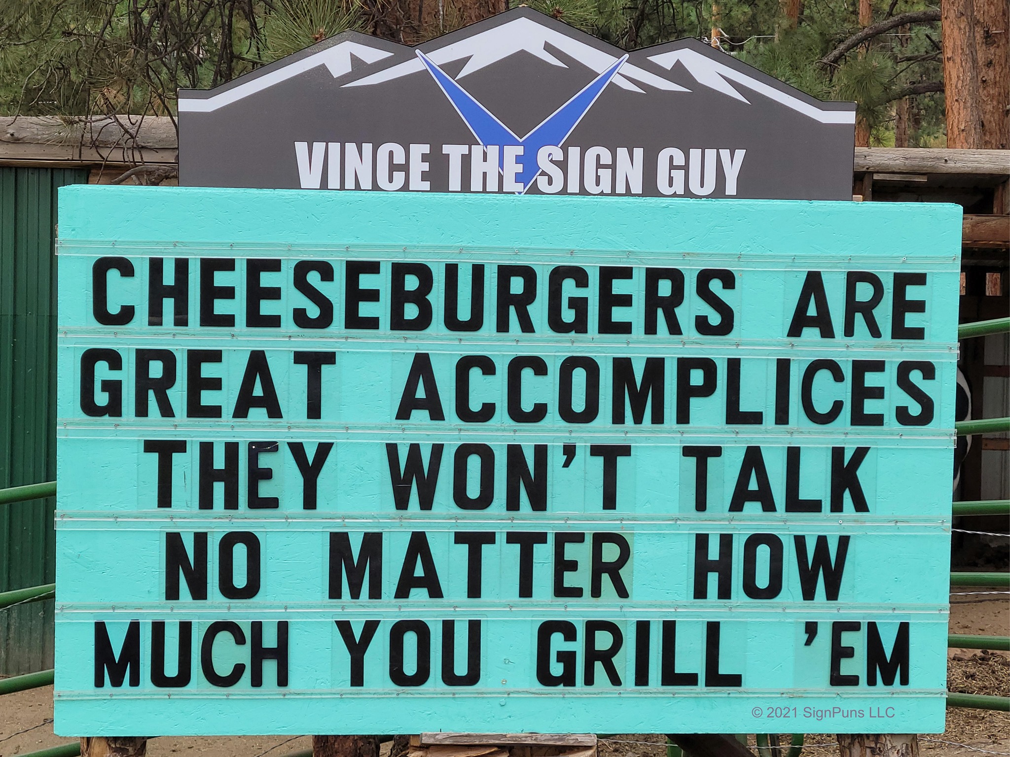 community sign that says: "cheeseburgers are great accomplices they won't talk no matter how much you trill 'em"
