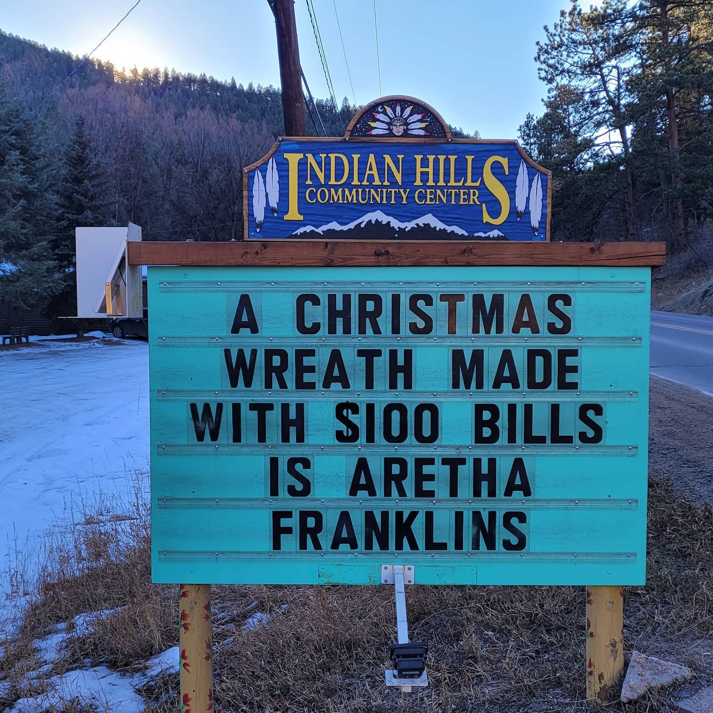 community sign that says: "a Christmas wreath made with $100 bills is Aretha Franklins"