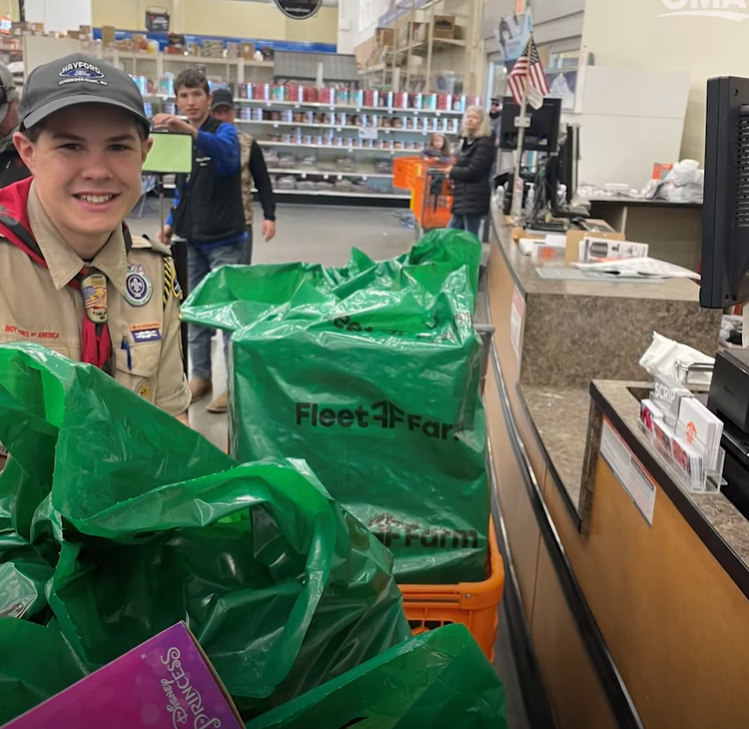 Boy Scout Jonathan werner buys toys for the less fortunate