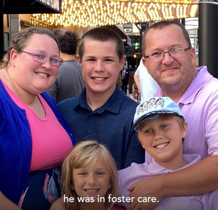 Jonathan Werner smiles with his parents and two siblings.