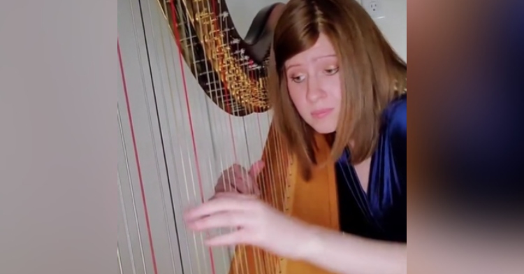 Harpist Kristan Toczko playing her instrument.
