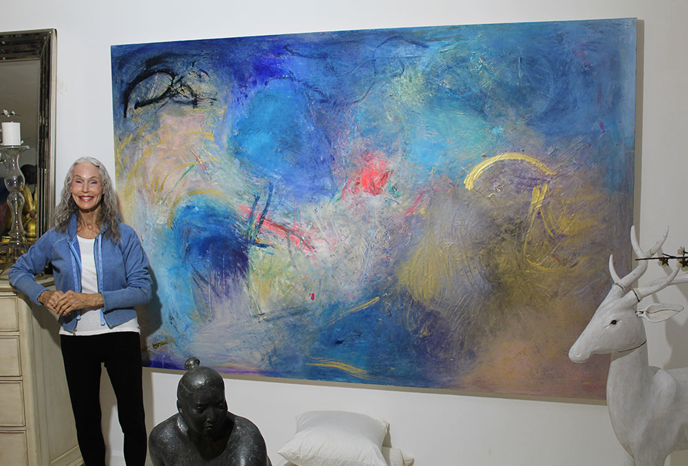 Sarah Bachrodt with one of her paintings.