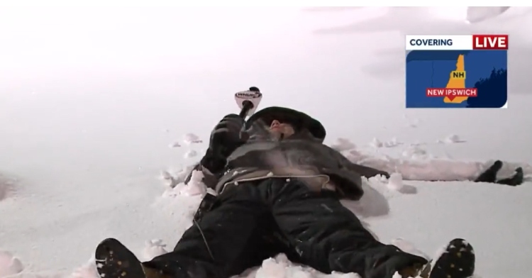Troy Lynch does snow angel while reporting for WMUR-TV