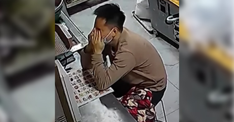 Exhausted dad rubs his eyes as he sits in the back of his restaurant, planning the menu.