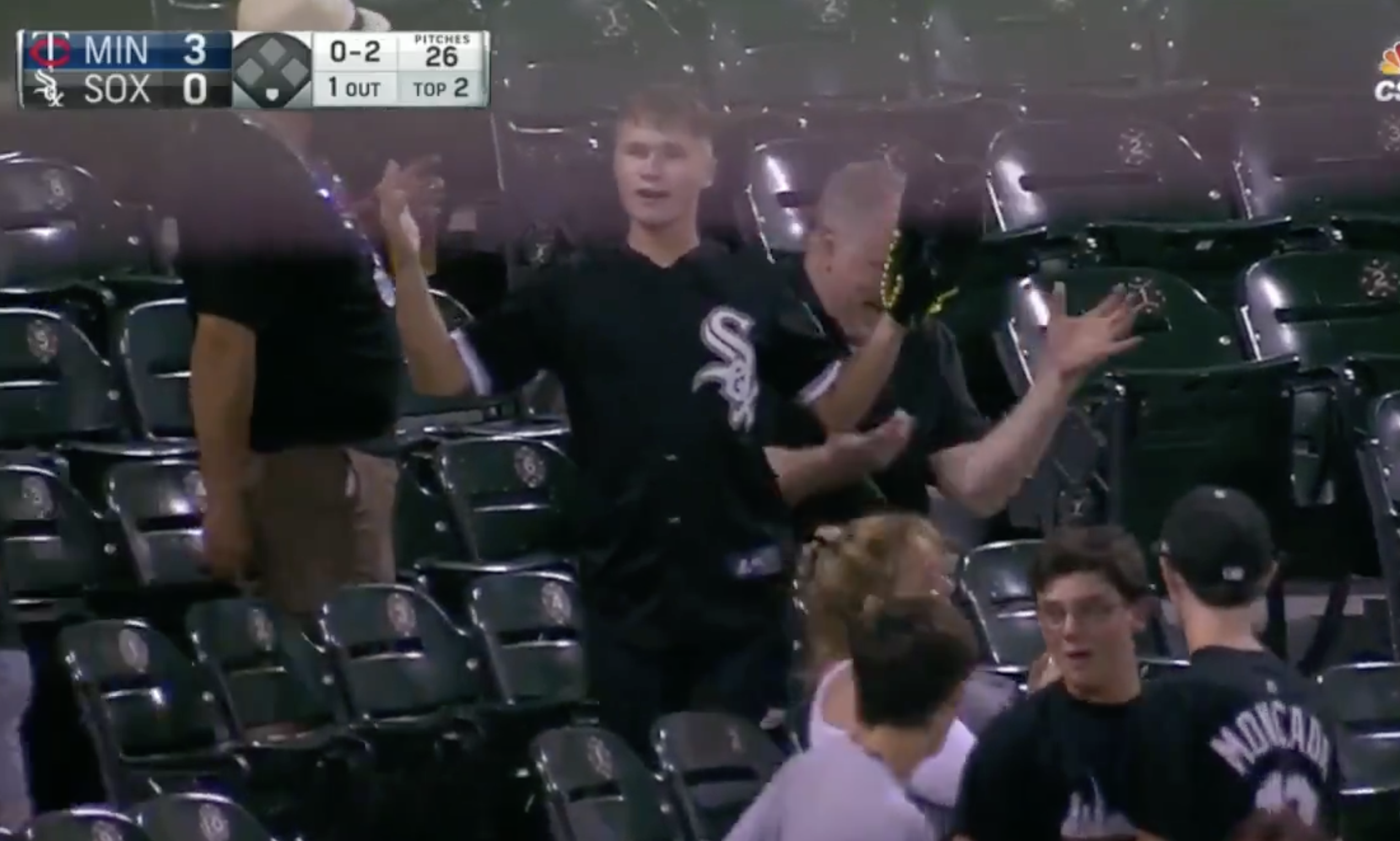 teen Ryan Baker with his arms in the air after a woman stole a baseball out of his hand. 