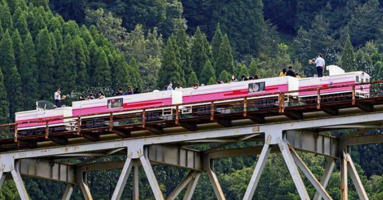 View of the Amaterasu Railway train in Japan as it transports folks.