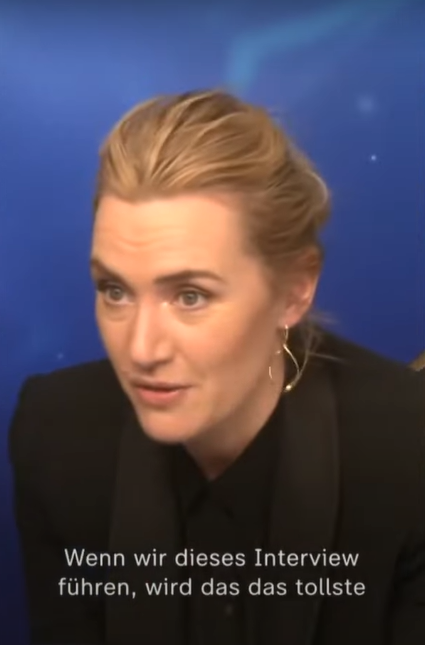 Kate Winslet talking to young reporter for ZDF. It is captioned, in German, "Wenn wir dieses Interview führen, wird das das tollste"