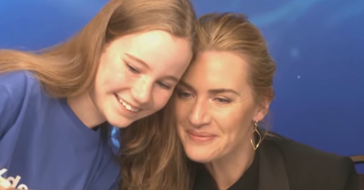 Kate Winslet offers words of encouragement to young reporter during her first interview.