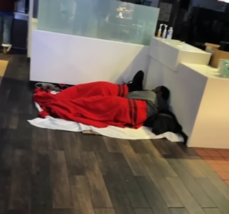 people sleeping on floor of McDonald's during blizzard.