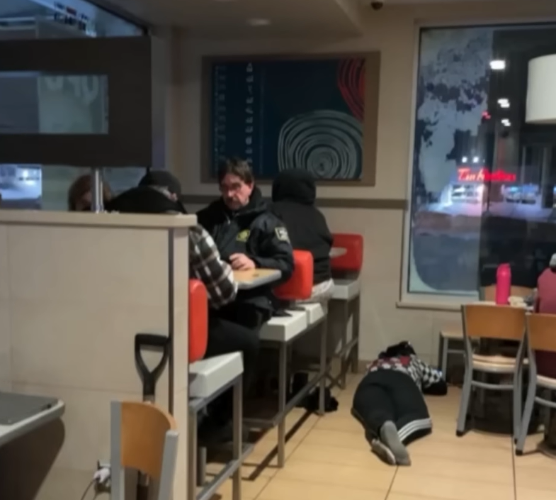 people sleeping and eating in McDonald's restaurant during 2022 blizzard in Buffalo, NY