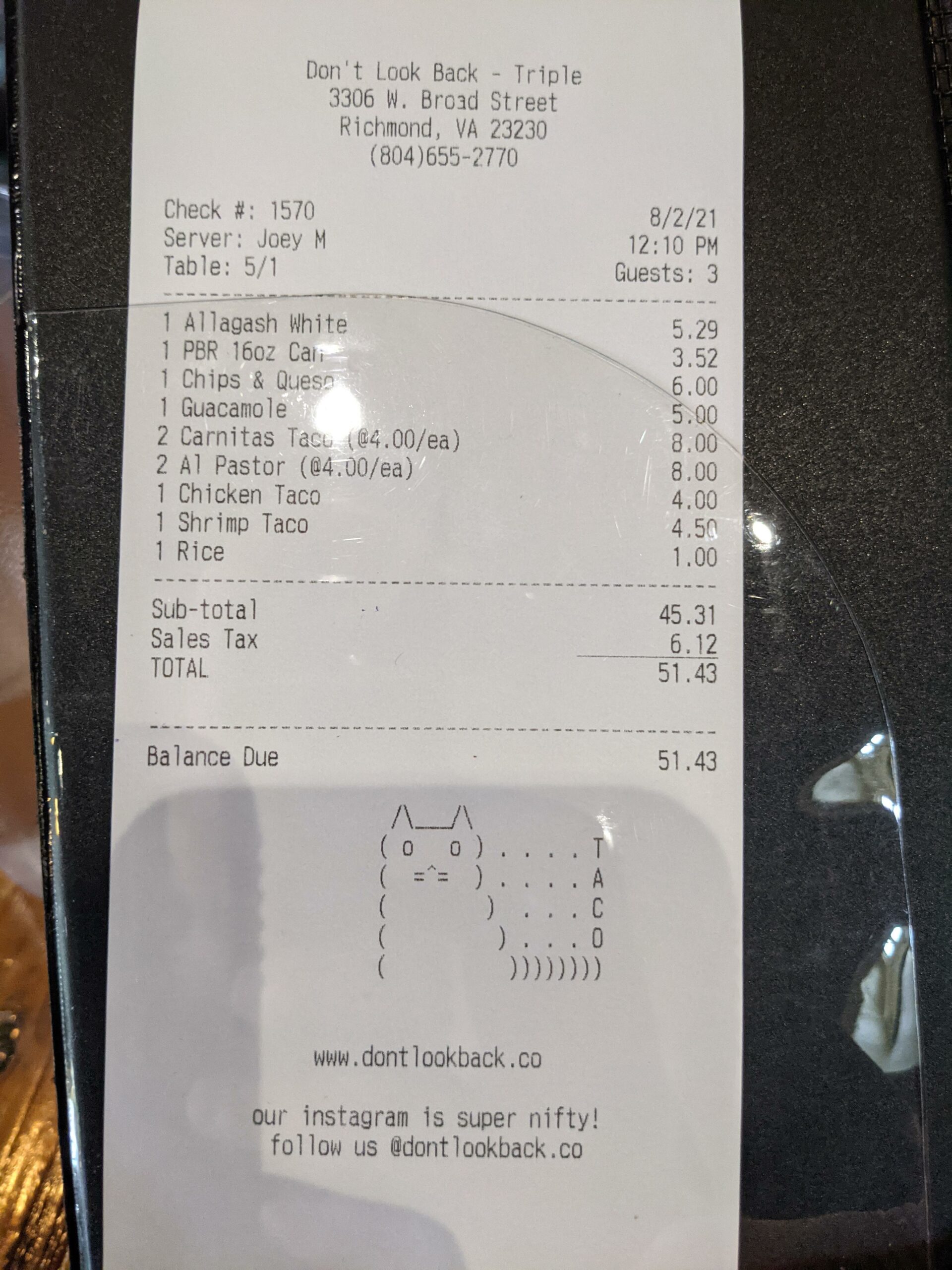Receipt that, at the bottom, has symbols made to look like a cat. Next to the cat, vertically, is the word "taco"